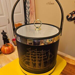 vintage ice bucket black with a sailboat design with a gold touch